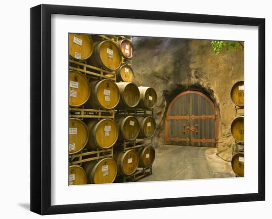 Oak Barrels Stacked Outside of Door at Ironstone Winery, Calaveras County, California, USA-Janis Miglavs-Framed Photographic Print