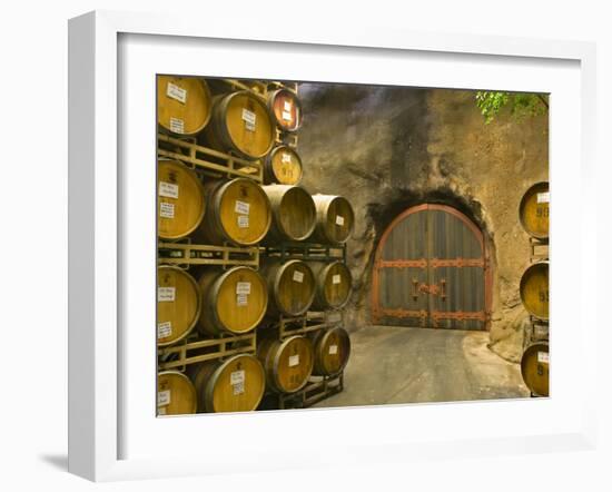 Oak Barrels Stacked Outside of Door at Ironstone Winery, Calaveras County, California, USA-Janis Miglavs-Framed Photographic Print