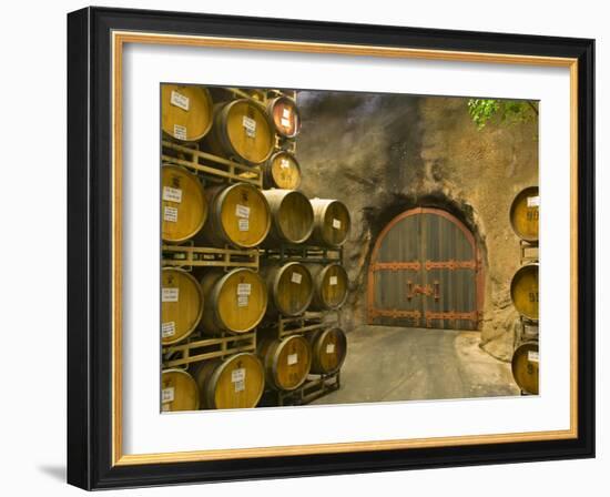 Oak Barrels Stacked Outside of Door at Ironstone Winery, Calaveras County, California, USA-Janis Miglavs-Framed Photographic Print