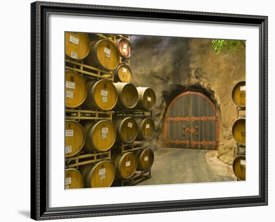 Oak Barrels Stacked Outside of Door at Ironstone Winery, Calaveras County, California, USA-Janis Miglavs-Framed Photographic Print