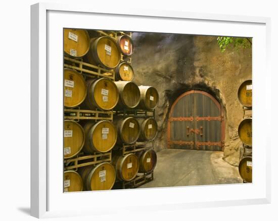 Oak Barrels Stacked Outside of Door at Ironstone Winery, Calaveras County, California, USA-Janis Miglavs-Framed Photographic Print