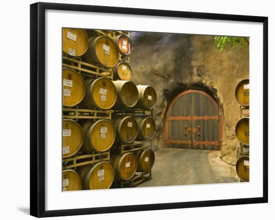 Oak Barrels Stacked Outside of Door at Ironstone Winery, Calaveras County, California, USA-Janis Miglavs-Framed Photographic Print