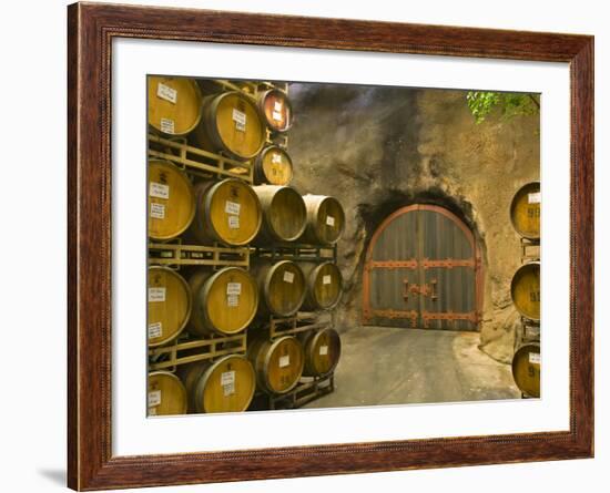 Oak Barrels Stacked Outside of Door at Ironstone Winery, Calaveras County, California, USA-Janis Miglavs-Framed Photographic Print