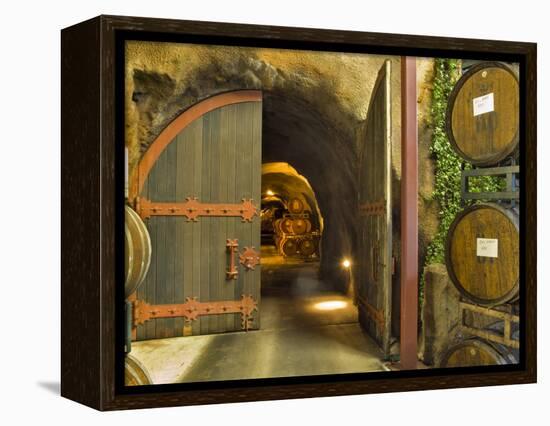 Oak Barrels Stacked Outside of Open Door To Aging Caves at Ironstone Winery, California, USA-Janis Miglavs-Framed Premier Image Canvas