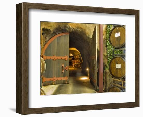 Oak Barrels Stacked Outside of Open Door To Aging Caves at Ironstone Winery, California, USA-Janis Miglavs-Framed Photographic Print