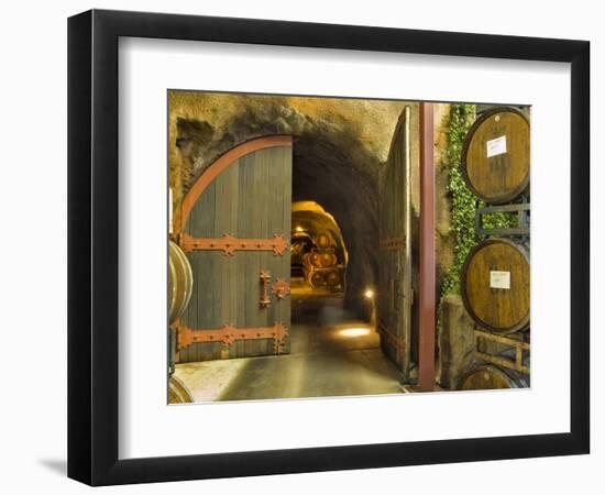 Oak Barrels Stacked Outside of Open Door To Aging Caves at Ironstone Winery, California, USA-Janis Miglavs-Framed Photographic Print