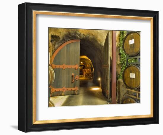 Oak Barrels Stacked Outside of Open Door To Aging Caves at Ironstone Winery, California, USA-Janis Miglavs-Framed Photographic Print