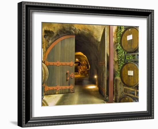 Oak Barrels Stacked Outside of Open Door To Aging Caves at Ironstone Winery, California, USA-Janis Miglavs-Framed Photographic Print