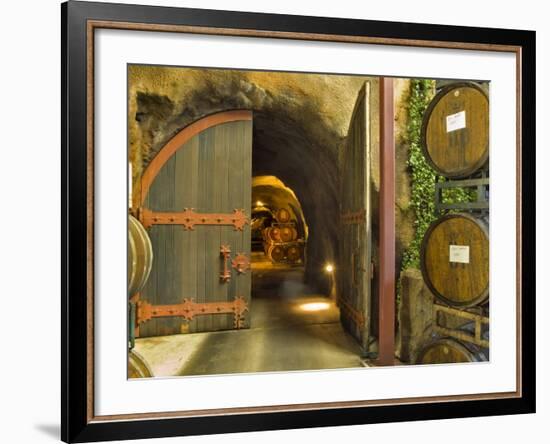 Oak Barrels Stacked Outside of Open Door To Aging Caves at Ironstone Winery, California, USA-Janis Miglavs-Framed Photographic Print