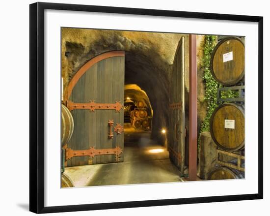 Oak Barrels Stacked Outside of Open Door To Aging Caves at Ironstone Winery, California, USA-Janis Miglavs-Framed Photographic Print
