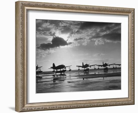 Observation Planes Sitting at Water's Edge at a US Navy Air Base-null-Framed Photographic Print