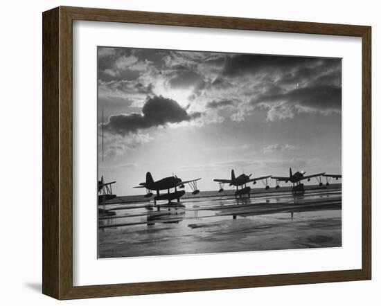 Observation Planes Sitting at Water's Edge at a US Navy Air Base-null-Framed Photographic Print