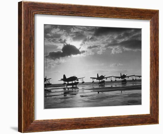 Observation Planes Sitting at Water's Edge at a US Navy Air Base-null-Framed Photographic Print