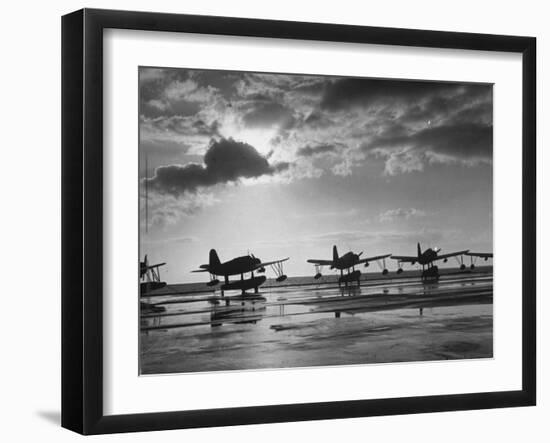 Observation Planes Sitting at Water's Edge at a US Navy Air Base-null-Framed Photographic Print