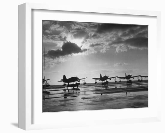 Observation Planes Sitting at Water's Edge at a US Navy Air Base-null-Framed Photographic Print