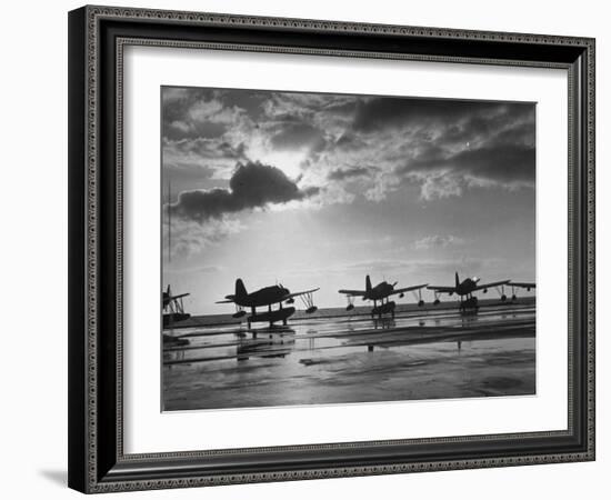 Observation Planes Sitting at Water's Edge at a US Navy Air Base-null-Framed Photographic Print