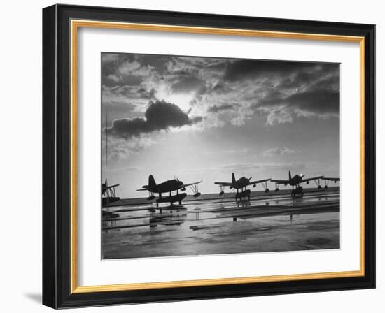 Observation Planes Sitting at Water's Edge at a US Navy Air Base-null-Framed Photographic Print