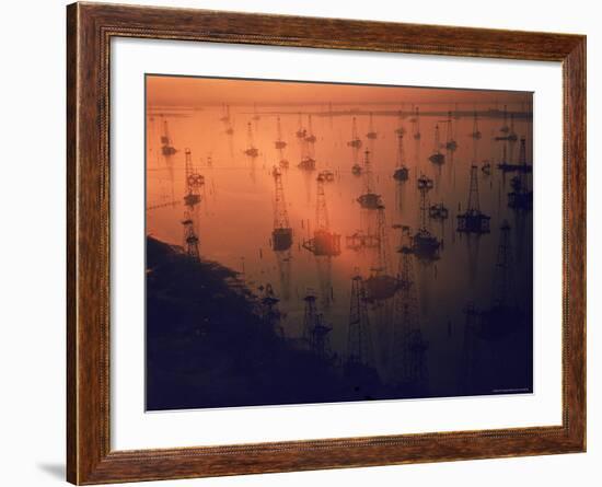 Oil Rigs Dating from the 1920's Dot the Shallows of Galveston Bay-Ralph Crane-Framed Photographic Print