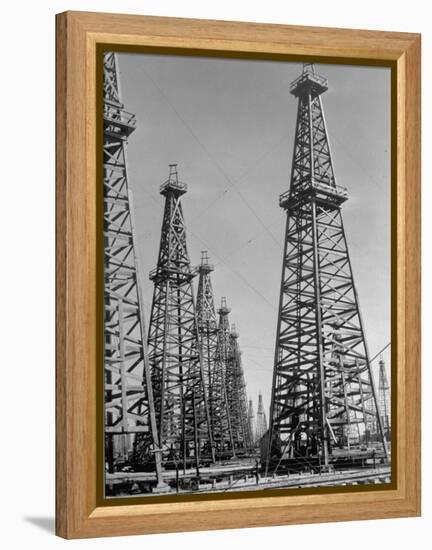 Oil Well Rigs in a Texaco Oil Field-Margaret Bourke-White-Framed Premier Image Canvas