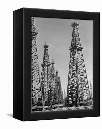 Oil Well Rigs in a Texaco Oil Field-Margaret Bourke-White-Framed Premier Image Canvas