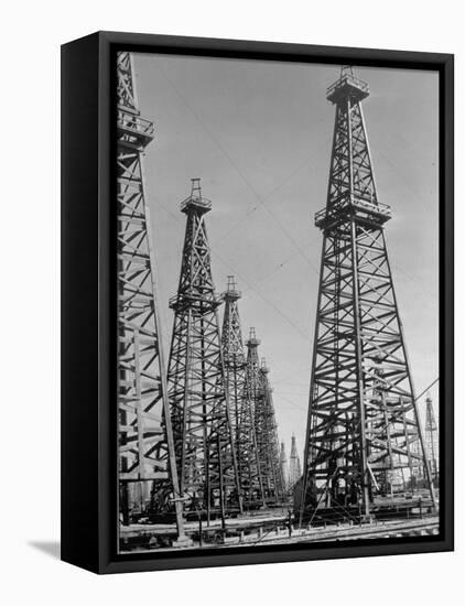 Oil Well Rigs in a Texaco Oil Field-Margaret Bourke-White-Framed Premier Image Canvas