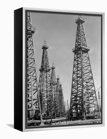 Oil Well Rigs in a Texaco Oil Field-Margaret Bourke-White-Framed Premier Image Canvas