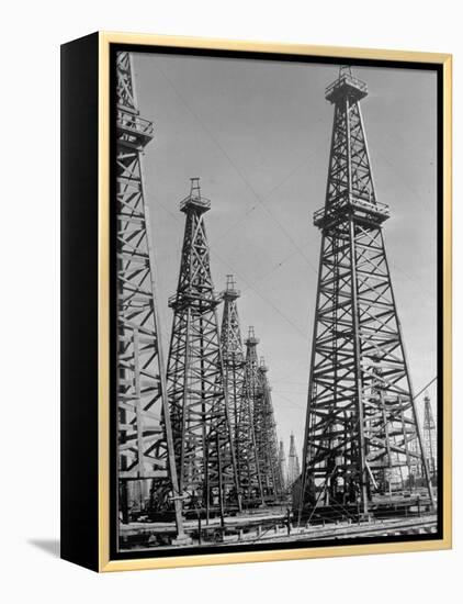 Oil Well Rigs in a Texaco Oil Field-Margaret Bourke-White-Framed Premier Image Canvas