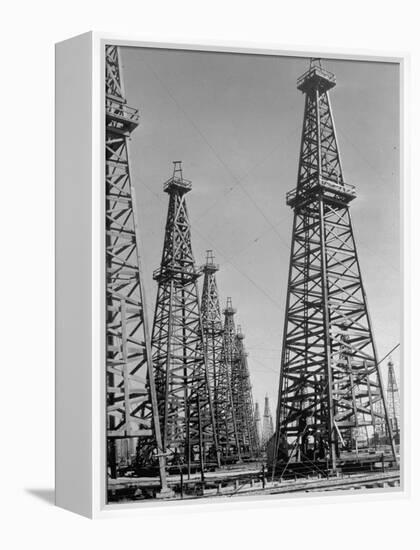 Oil Well Rigs in a Texaco Oil Field-Margaret Bourke-White-Framed Premier Image Canvas