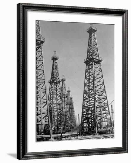 Oil Well Rigs in a Texaco Oil Field-Margaret Bourke-White-Framed Premium Photographic Print