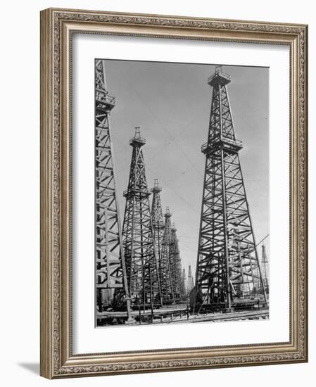 Oil Well Rigs in a Texaco Oil Field-Margaret Bourke-White-Framed Photographic Print