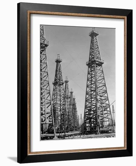 Oil Well Rigs in a Texaco Oil Field-Margaret Bourke-White-Framed Photographic Print