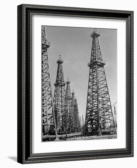 Oil Well Rigs in a Texaco Oil Field-Margaret Bourke-White-Framed Photographic Print