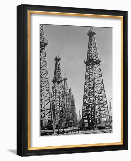 Oil Well Rigs in a Texaco Oil Field-Margaret Bourke-White-Framed Photographic Print