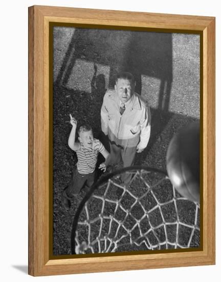 Oklahoma A&M Basketball Coach Hank Iba Watching a Young Boy Shooting a Basket-Myron Davis-Framed Premier Image Canvas