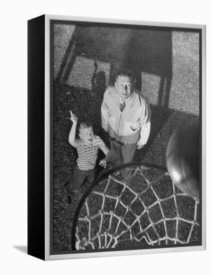 Oklahoma A&M Basketball Coach Hank Iba Watching a Young Boy Shooting a Basket-Myron Davis-Framed Premier Image Canvas