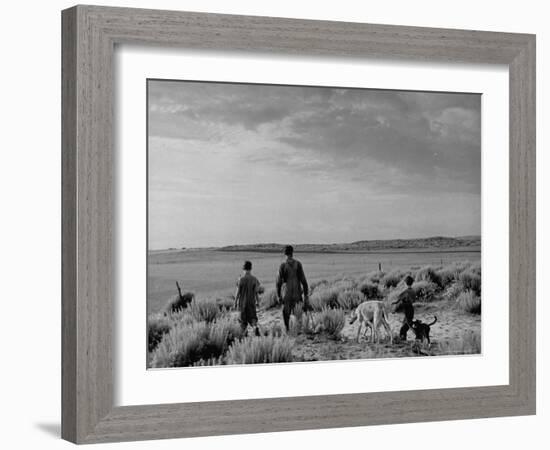 Oklahoma Farmer with His Two Sons and Their Dogs Walking Toward a Fenced in Field-Alfred Eisenstaedt-Framed Photographic Print