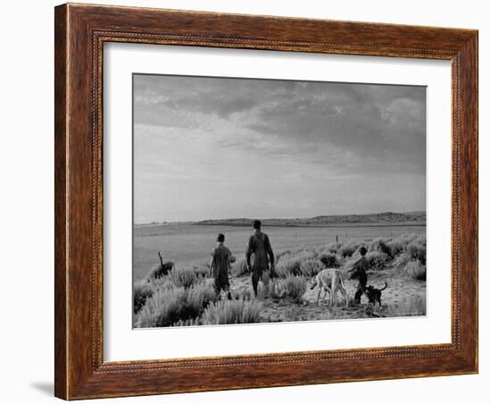 Oklahoma Farmer with His Two Sons and Their Dogs Walking Toward a Fenced in Field-Alfred Eisenstaedt-Framed Photographic Print