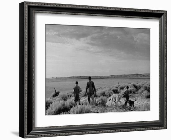 Oklahoma Farmer with His Two Sons and Their Dogs Walking Toward a Fenced in Field-Alfred Eisenstaedt-Framed Photographic Print