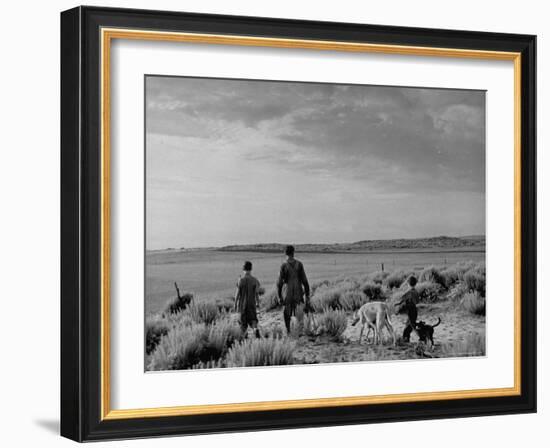 Oklahoma Farmer with His Two Sons and Their Dogs Walking Toward a Fenced in Field-Alfred Eisenstaedt-Framed Photographic Print