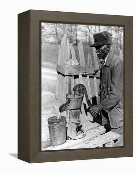 Old African American Sharecropper Dave Alexander Using Water Pump to Draw Water-Alfred Eisenstaedt-Framed Premier Image Canvas