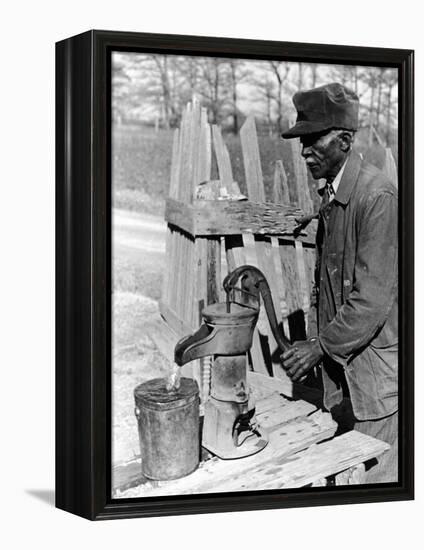 Old African American Sharecropper Dave Alexander Using Water Pump to Draw Water-Alfred Eisenstaedt-Framed Premier Image Canvas