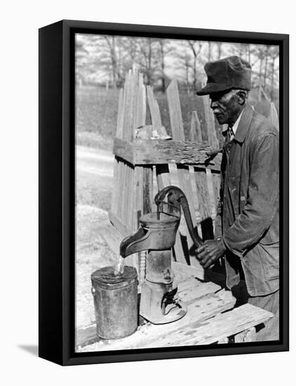 Old African American Sharecropper Dave Alexander Using Water Pump to Draw Water-Alfred Eisenstaedt-Framed Premier Image Canvas