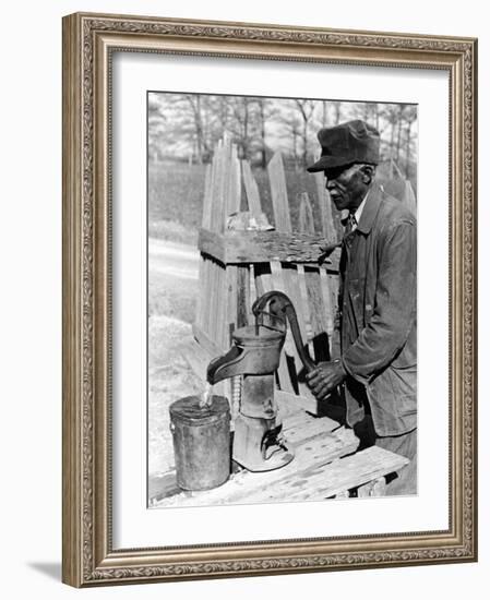 Old African American Sharecropper Dave Alexander Using Water Pump to Draw Water-Alfred Eisenstaedt-Framed Photographic Print