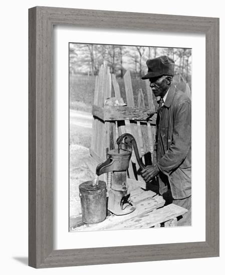 Old African American Sharecropper Dave Alexander Using Water Pump to Draw Water-Alfred Eisenstaedt-Framed Photographic Print