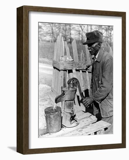 Old African American Sharecropper Dave Alexander Using Water Pump to Draw Water-Alfred Eisenstaedt-Framed Photographic Print