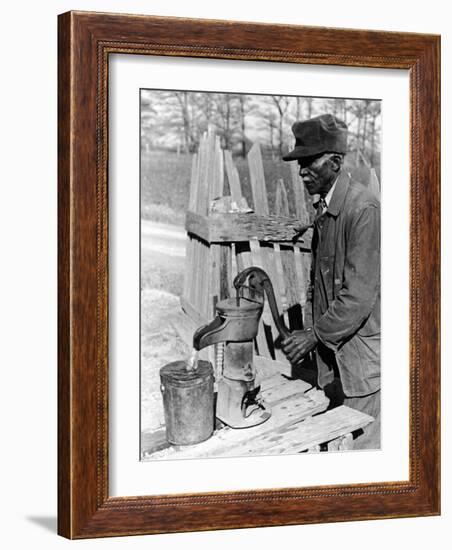 Old African American Sharecropper Dave Alexander Using Water Pump to Draw Water-Alfred Eisenstaedt-Framed Photographic Print