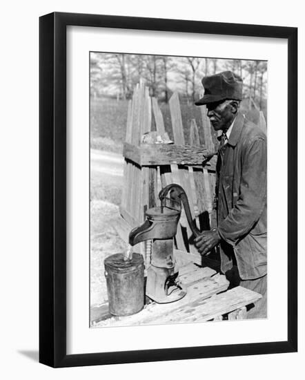 Old African American Sharecropper Dave Alexander Using Water Pump to Draw Water-Alfred Eisenstaedt-Framed Photographic Print