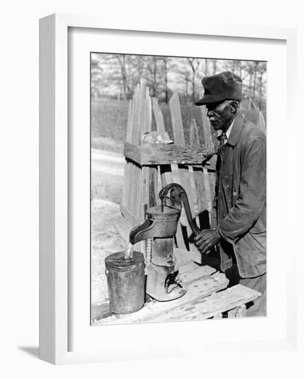 Old African American Sharecropper Dave Alexander Using Water Pump to Draw Water-Alfred Eisenstaedt-Framed Photographic Print