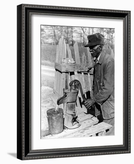 Old African American Sharecropper Dave Alexander Using Water Pump to Draw Water-Alfred Eisenstaedt-Framed Photographic Print