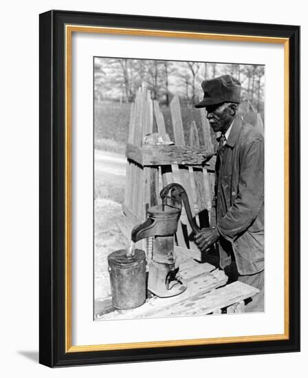Old African American Sharecropper Dave Alexander Using Water Pump to Draw Water-Alfred Eisenstaedt-Framed Photographic Print